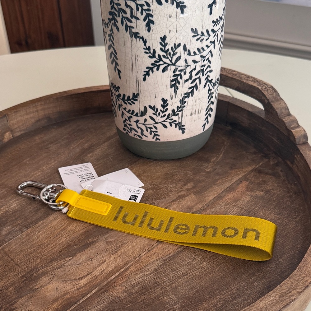 Lululemon never lost keychain in maize yellow and graphite gray NWT